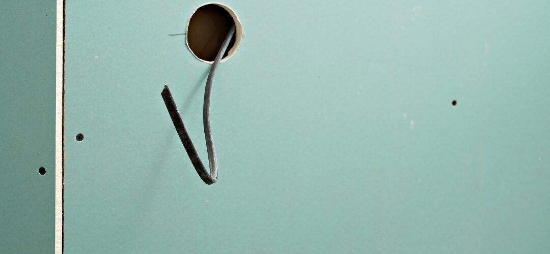 What Causes Nail Pops in Drywall and How Professionals Fix Them